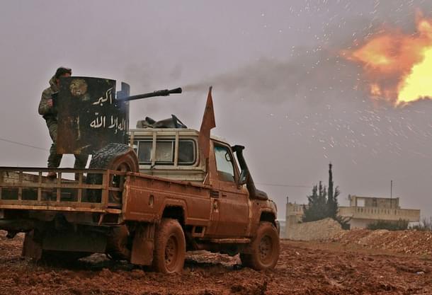 Syrian opposition fighters fire towards positions held by IS jihadists in Al Bab on the outskirts of Aleppo. (SALEH ABO GHALOUN/AFP/GettyImages)
