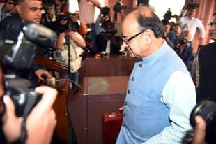 Finance Minister Arun Jaitley walks past media representatives prior to presenting the Union Budget at Parliament House in New Delhi. (PRAKASH SINGH/AFP/GettyImages) 