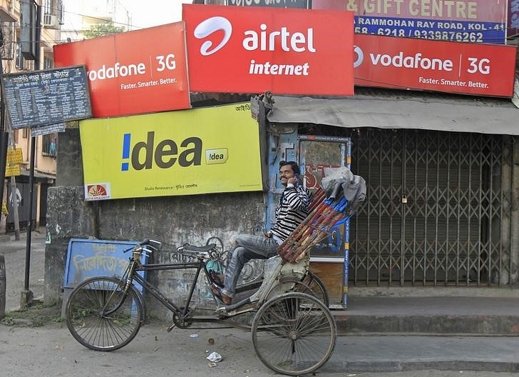 Advertisements for Vodafone, Idea, and Airtel