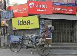 Advertisements for Vodafone, Idea, and Airtel