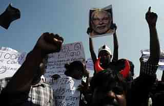 Students shout slogans and hold placards during a demonstration against the ban on Jallikattu. (ARUN SANKAR/AFP/Getty Images)