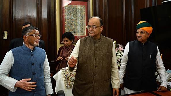 

Union Finance Minister, Arun Jaitley, centre, speaks with members of his team in his office the day before presenting the Union Budget 2017-2018, in New Delhi on 31 January  2017. (SAJJAD HUSSAIN/AFP/GettyImages)