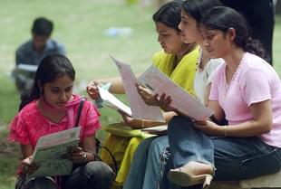 Indian students read admission forms at the Delhi University. (MANPREET ROMANA/AFP/Getty Images)
