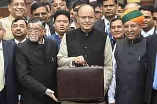 Finance Minister Arun Jaitley (centre) leaves his office to table the budget in Parliament in New Delhi on 1 February  2017. (DOMINIQUE FAGET/AFP/Getty Images)