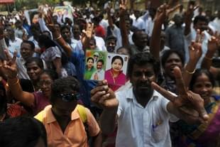 Supporters of the AIADMK party celebrate in front of the residence of the acting chief minister O Panneerselvam in Chennai. (ARUN SANKAR/AFP/GettyImages)
