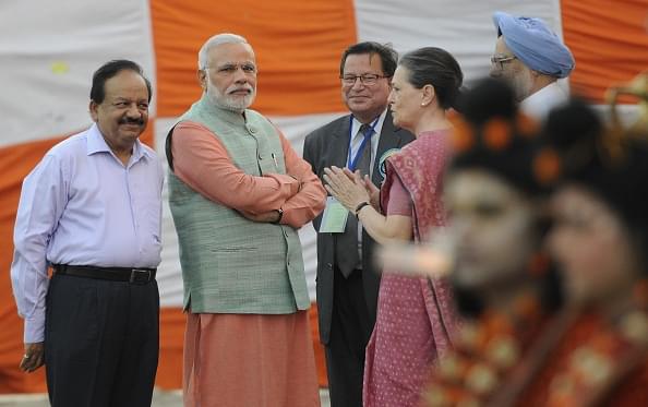 Prime Minister Narendra Modi interacts with Congress president Sonia Gandhi during Dussehra celebrations in 2014. (Sonu Mehta/Hindustan Times via Getty Images)