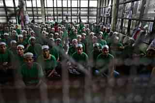 
Illegal 
Rohingya 

immigrants 
gather at an Immigration Detention Centre. 
