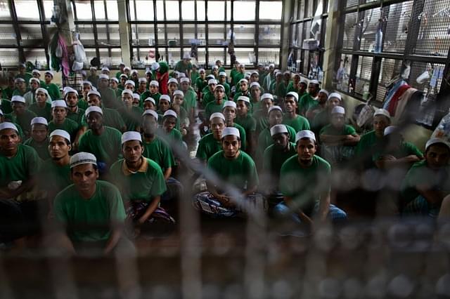
Illegal 
Rohingya 

immigrants 
gather at an Immigration Detention Centre. 
