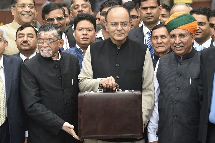 Finance Minister Arun Jaitley (centre) leaves his office to table the budget in Parliament in New Delhi today (1 February). (DOMINIQUE FAGET/AFP/GettyImages)