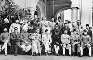 

Muslim League leaders after a dinner party given at the residence of Mian Bashir Ahmad, Lahore, 1940. Group portrait with Jinnah seated in the centre. (British Library)