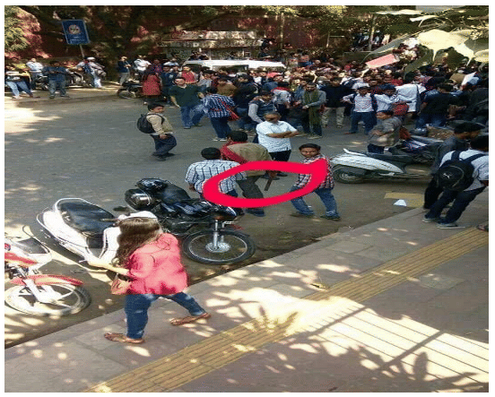 AISA activists wielding iron rods that were used to hit DU students and ABVP activists