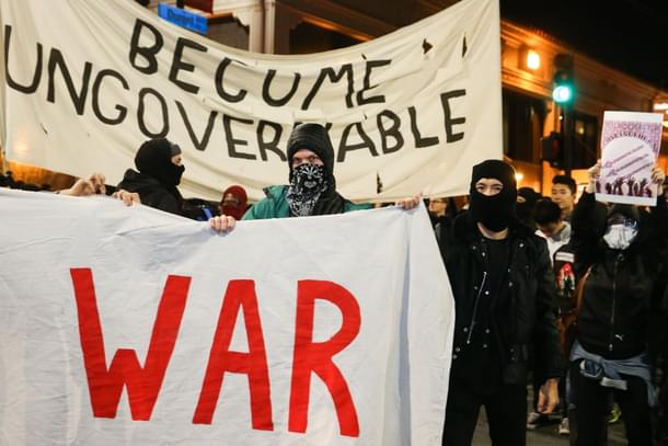 People protesting controversial Breitbart writer Milo Yiannopoulos take to the streets on in Berkeley, California. (Elijah Nouvelage/Getty Images)