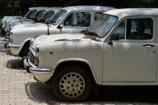 Defunct Ambassador cars of the state government gather dust at a parking lot in Bengaluru.(MANJUNATH KIRAN/AFP/GettyImages)