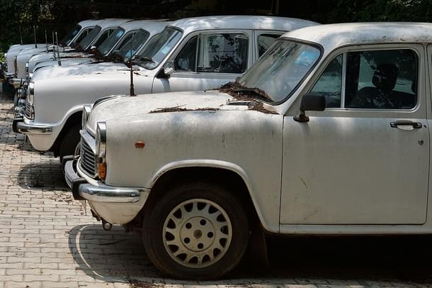 Defunct Ambassador cars of the state government gather dust at a parking lot in Bengaluru.(MANJUNATH KIRAN/AFP/GettyImages)