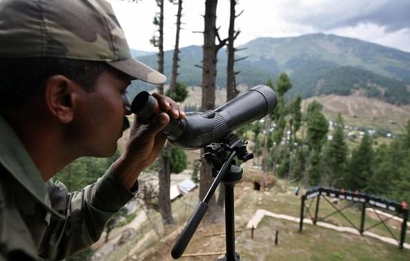 

A  soldier guards the line of control. (Farooq Khan-Pool/GettyImages)