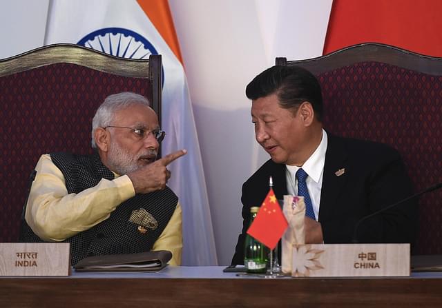Modi and Xi Jingping (PRAKASH SINGH/AFP/Getty Images)