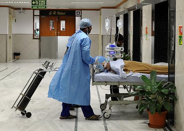 Hospital staff shift a patient at the Narayana Hrudayalaya cardiac-care hospital in Bengaluru. (representative image) (Manjunath Kiran/AFP/Getty Images)