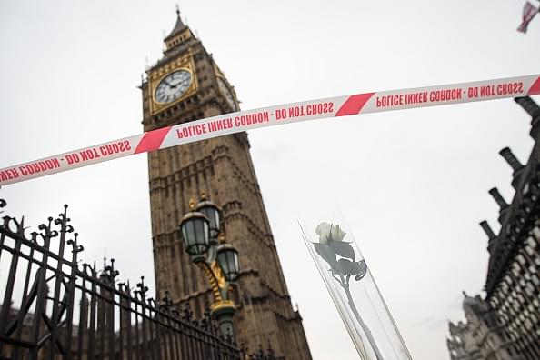 Police tape and a rose placed in a traffic cone are seen with Big Ben in the background on Westminster Bridge after the terror attack outside UK Parliament in London, England. (Jack Taylor/Getty Images)