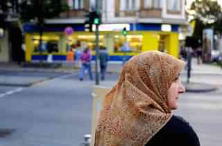 A Muslim woman waits to cross a street in Berlin’s Neukoelln district. (Sean Gallup/Getty Images)