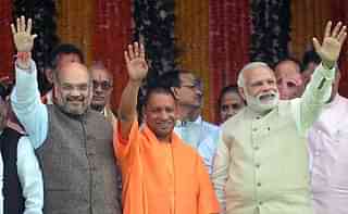 BJP President Amit Shah, Yogi Adityanath and Prime Minister Modi at an election rally in UP.