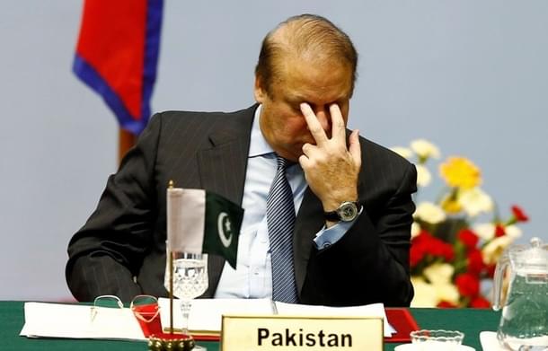 Pakistani Prime Minister Nawaz
Sharif reacts as he attends the opening session of 18th SAARC summit in Kathmandu.<br>