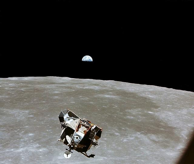 Over the Moon, with a half-Earth in the background. (NASA/Newsmakers)