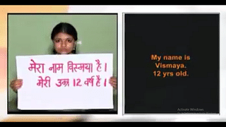 Vismaya holds up a placard in the video.
