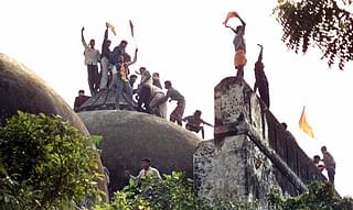 Hindu youth demolishing Babri Masjid.