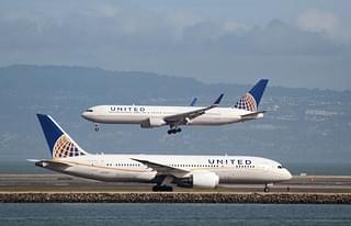 
A United Airlines Boeing 787 taxis as a United Airlines Boeing 767 lands.

