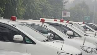 Government vehicles with red beacons.