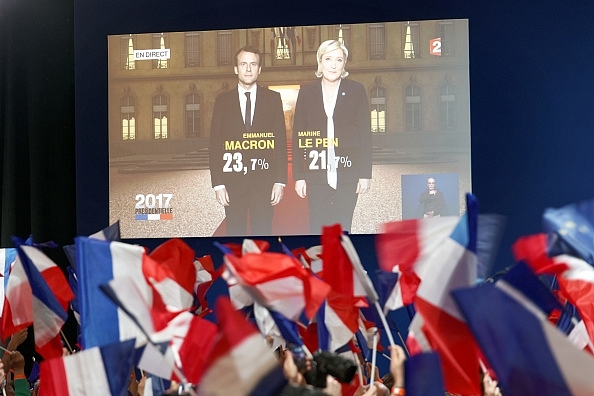 Far-right candidate Marine Le Pen and center-left candidate Emmanuel Macron. (Sylvain Lefevre/Getty Images)