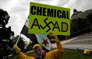 A protester on the street against use of chemical weapons by Assad against his own people in Syria. (Win McNamee/Getty Images)