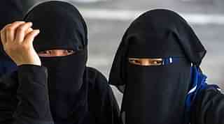 Muslim women in niqab.