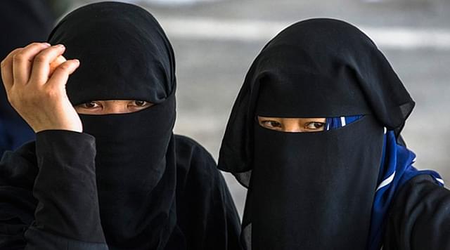 Muslim women in niqab.