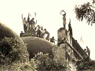 Hindu youth atop the disputed structure in Ayodhya&nbsp;