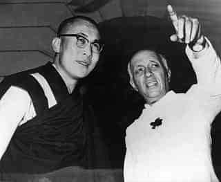 Tibetan spiritual leader the Dalai Lama and former Indian Prime Minister Jawaharlal Nehru in New Delhi. (Central Press/Getty Images)