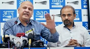 Delhi Deputy Chief Minister Manish Sisodia with party leader Dilip Pandey. 