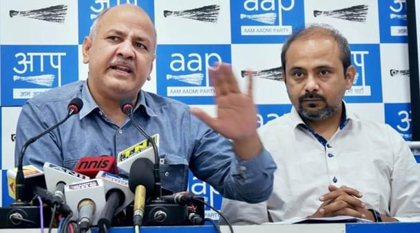 Delhi Deputy Chief Minister Manish Sisodia with party leader Dilip Pandey. 
