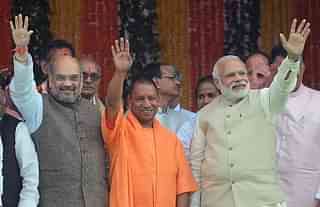 Narendra Modi, Yogi Adityanath and Amit Shah (SANJAY KANOJIA/AFP/Getty Images)