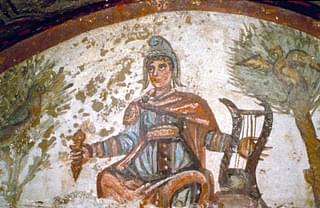 This is early Christian depiction of Jesus as Orpheus with

Mithra cap and musical instrument- Catacombs of Peter and

Marcellus, Rome 4 th century CE
