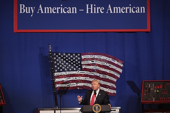 US President Donald Trump signed an executive order  seeking to revamp the H-1B visa  programme. (Scott Olson/Getty Images)