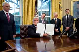 

U.S. President Donald Trump shows the Executive Order withdrawing the US from the Trans-Pacific Partnership (TPP)  (Ron Sachs - Pool/Getty Images)