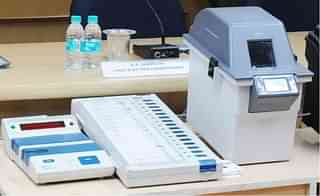 Image of a Voter Verifiable Paper Audit Trail (VVPAT) machine with an EVM, or electronic voting machine. (Photo Via PIB)