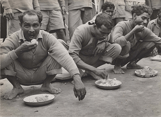 Chabua, Assam, India, April 1944,  Indian air freight workers eating rice.(Photo courtesy: Army Air Forces, Air Transport Command, Overseas Technical Unit, Washington DC)