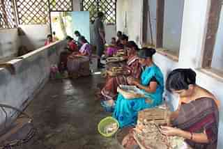 Women work in a small village industry in Kerala