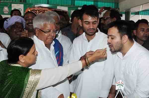 Former Bihar CMs Rabri Devi, Lalu Prasad and their two sons. (AP Dube/Hindustan Times via Getty Images)