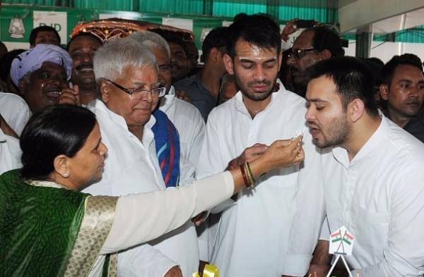 Former Bihar chief minister Rabri Devi  with husband Lalu Prasad and their two sons. (AP Dube/Hindustan Times via Getty Images)
