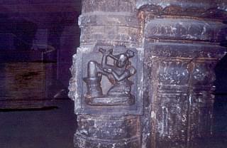 Kannappa offers his  eye to Shiva keeping his leg on the Shiva Linga, pillar sculpture in a Vishnu temple in Kanyakumari district.