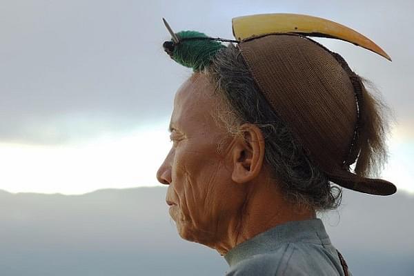 A Nishi tribesman wearing the traditional head-dress having a hornbill beak. (Vinod Panicker/Wikimedia Commons)