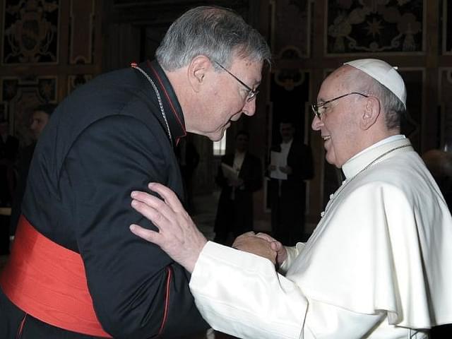 Cardinal George Pell (left) meets with Pope Francis. 

